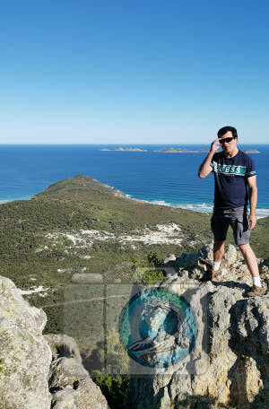 Kenneth Springer standing at the cliff edge with an Ocean backdrop